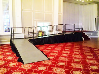 ADA stage ramp with rails